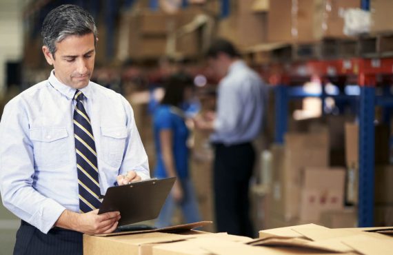 Manager In Warehouse Checking Boxes Manager In Warehouse Checking Boxes